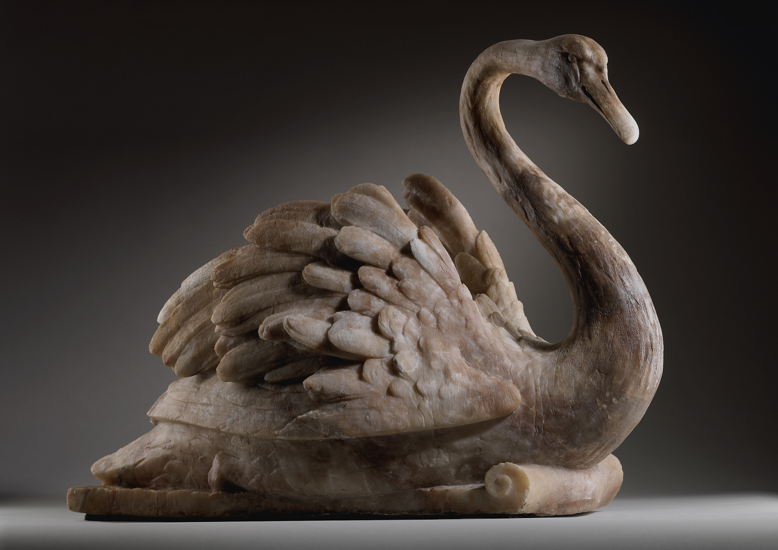 A set of four English alabaster swans